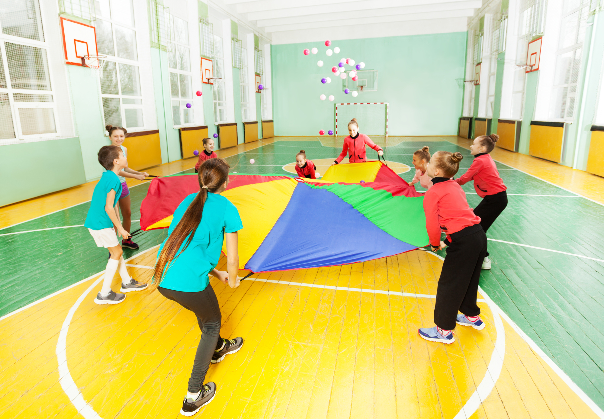 children playing  sports festival in school gymnasium Equip2flourish
